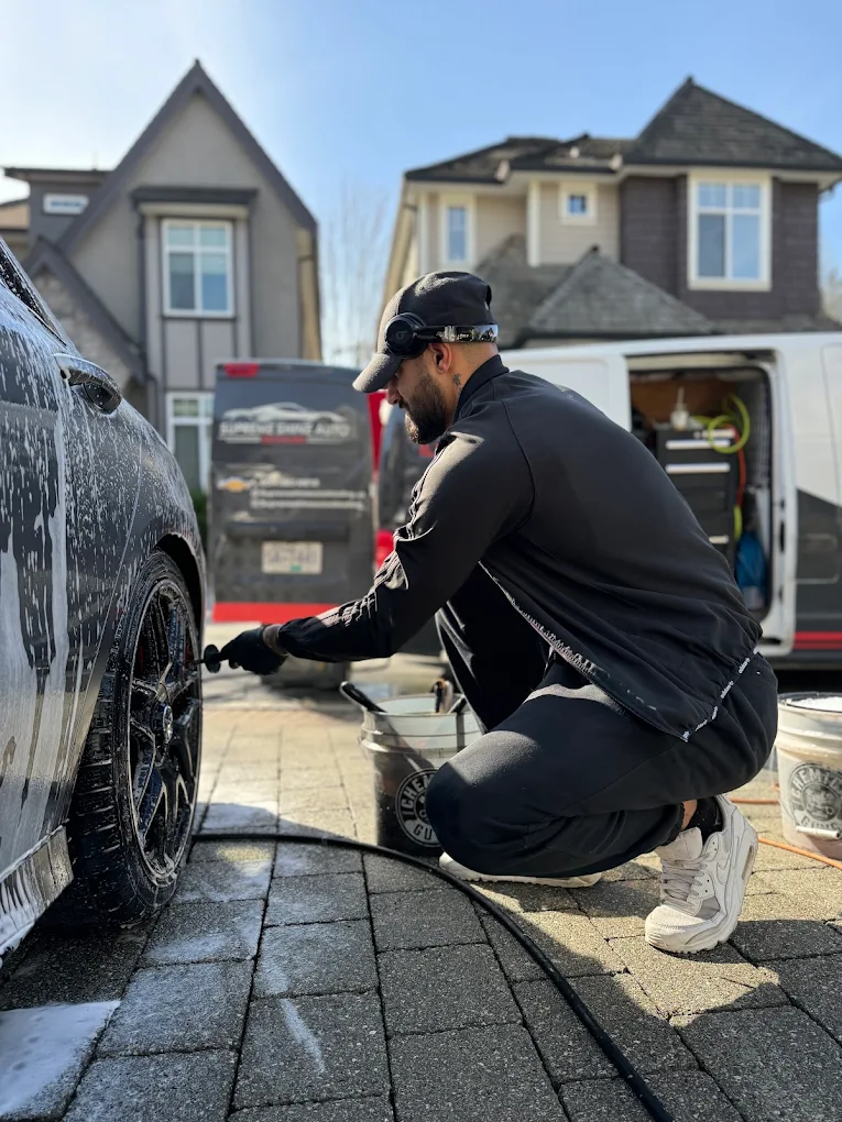 Luxury vehicle covered in foam during a professional wash